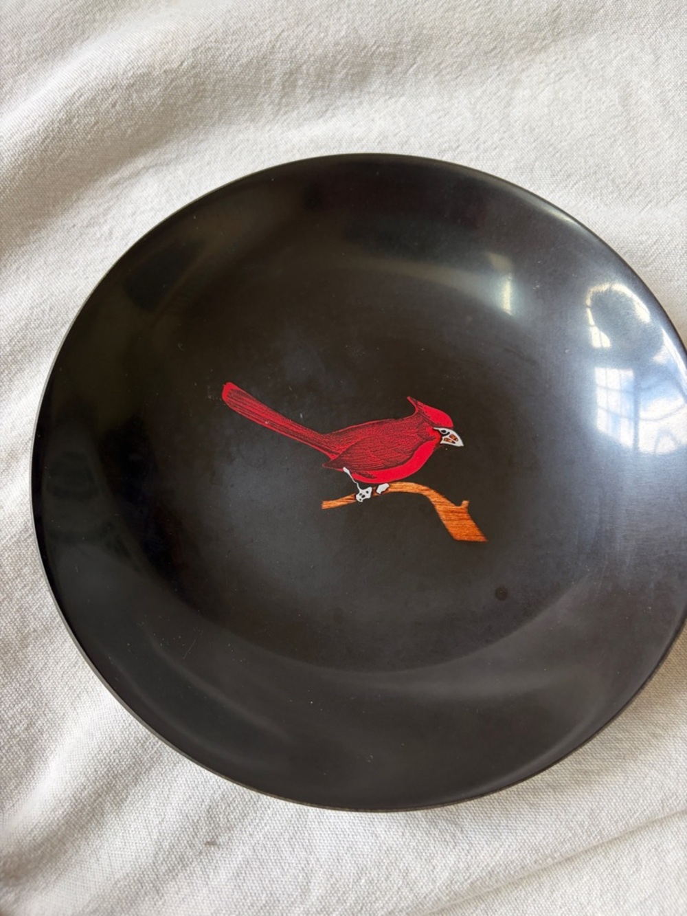 Black Decorative Plate with Red Cardinal Motif